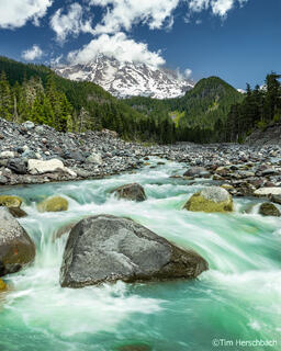 Photograph of Mount Rainier and the Nisqually River on a sunny day.
